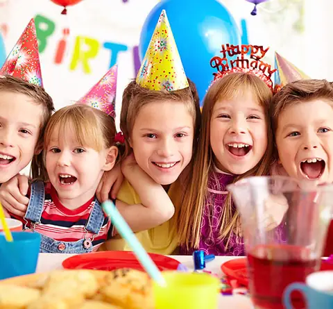 Children's birthday: party hats, balloons and snacks
